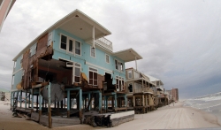 damged homes along beach hurricane 14