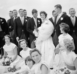 Kennedys in wedding attire with members of the wedding party
