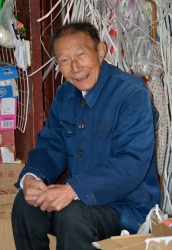 Smiling Old Man Sitting Outside Food Stall Shanghai