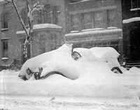 snow covered automobile after blizzard 1922