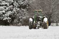 Snow covered tractor
