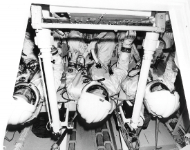 Three NASA Apollo astronauts participate in crew equipment 