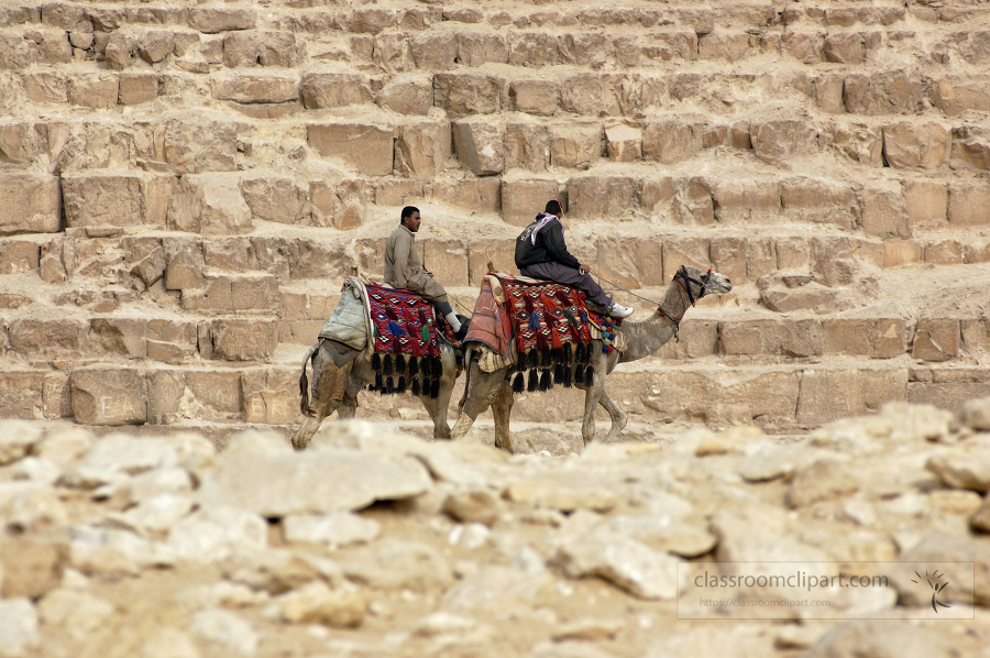 men riding camels along great pyramid egypt