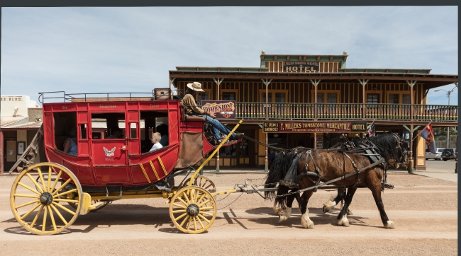 stagecoach driver and horses pause on the streets of tombstone a