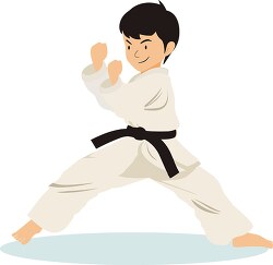 boy practices karate pose as a black belt