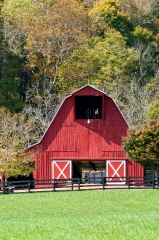red barn with fall folliage