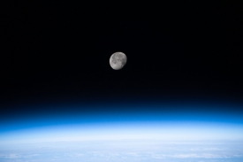 the waning gibbous moon above the earths horizon