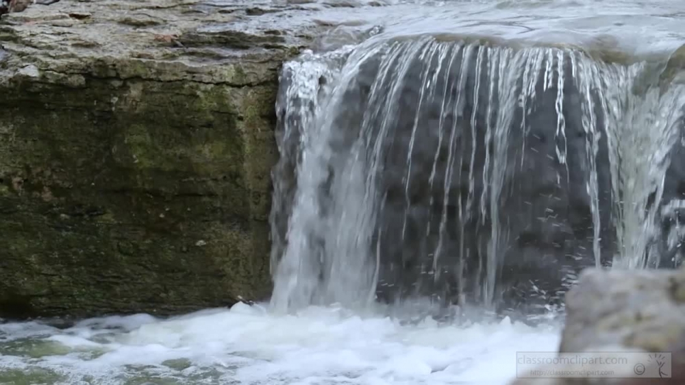 slow motion video of small water fall created after rain