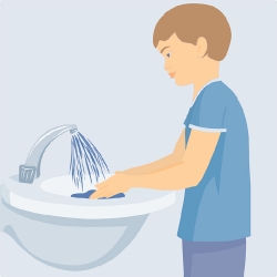 boy washing hands soap and water light background