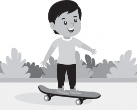 cute little boy riding skateboard in park gray color