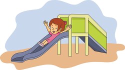girl going down playground slide