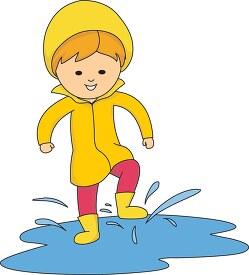 girl splashing in a puddle of water