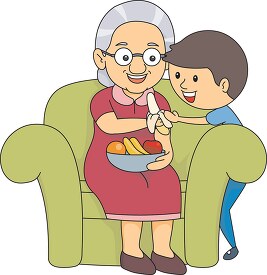 grandmother giving banana fruit to a child