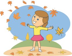 happy girl surrounded by falling autumn foliage