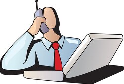 man sitting at a desk talking on a cell phone
