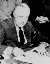  Franklin D. Roosevelt signing the Declaration of War