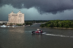 A tugboat plies the Savannah River in Savannah Georgia