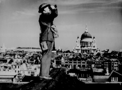 Aircraft spotter on the roof of a building in London