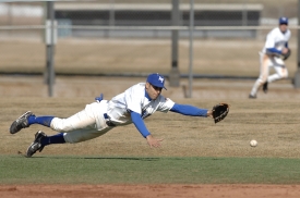 alazar dives for a hard hit ground ball