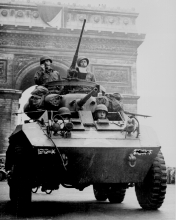 American troops in tank passing the Arc de Triomphe