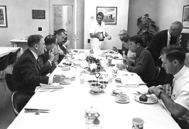 Apollo 7 astronauts breakfast with NASA officials prior to their