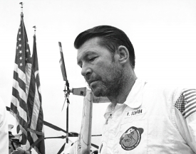 Apollo 7 Commander Schirra pauses in front of honor guard on fli