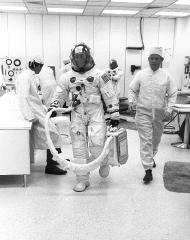 Astronaut Donn Eisele leaves the Suiting facility