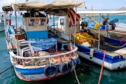 blue fishing boats in greece