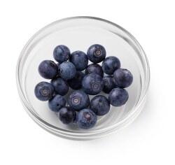 blueberries in bowl on white background