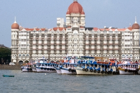 Boats docked in frot of Taj Mahal Palace and Tower Mumbia India