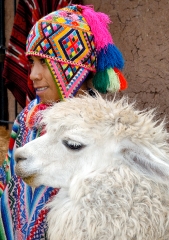 boy dressed in traditional clothing with alpaca peru 001