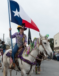 carries-the-texas-flag-in-the-big-parade