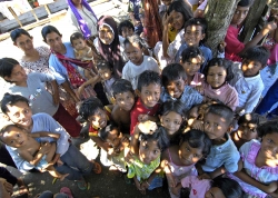 Children smile and gather for a group photo sumatra