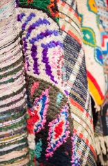 closeup colorful carpets for sale in the medina morocco photo 59