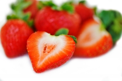 closeup photo image of group strawberries on white background