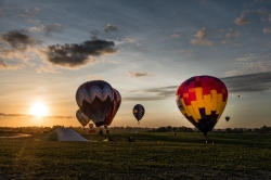 Colorful balloons in a night glow in Iowa