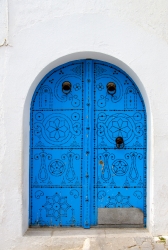 colorful blue door on white building tunis tunisia