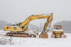 construction equipment covered with snow