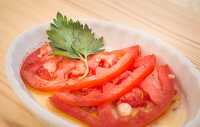 Dish with tomato parsley garlic