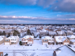 drone photo snow covered neighborhood