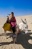 Egyptian Girl Sitting On Donkey