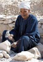 Egyptian Man Working With Stones Near Temple Photo 