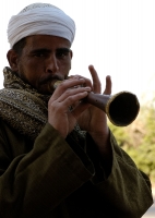 egyptian-man-playing-horn-photo-image-5060