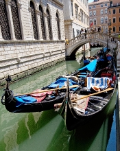 Gondolas on the narrow canal in Venice