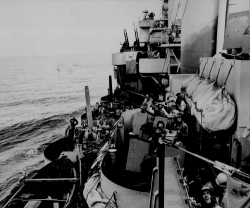 gun crews of a Navy cruiser