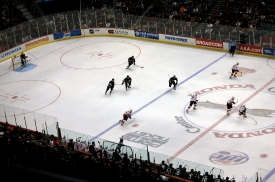 hockey players in action on arena