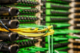installs a fiber optic jumper cable at the Data Center