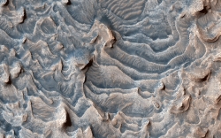 layered rock formation within Jiji Crater