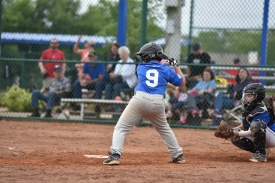 little leage player at home plate
