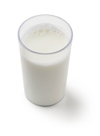 low-fat milk in clear cup